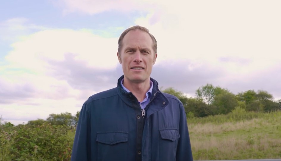 Kris Carpenter standing on open land