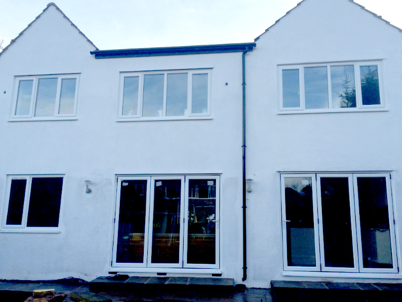 Barnsley Road house finished in white render with new glazing